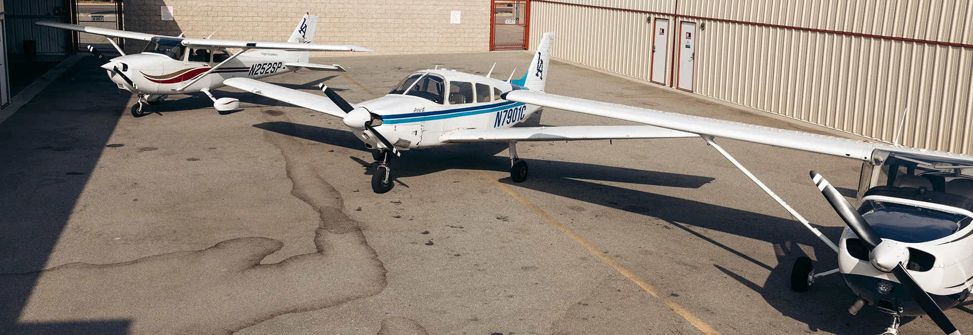 Three LA Flight Academy aircraft on the patio