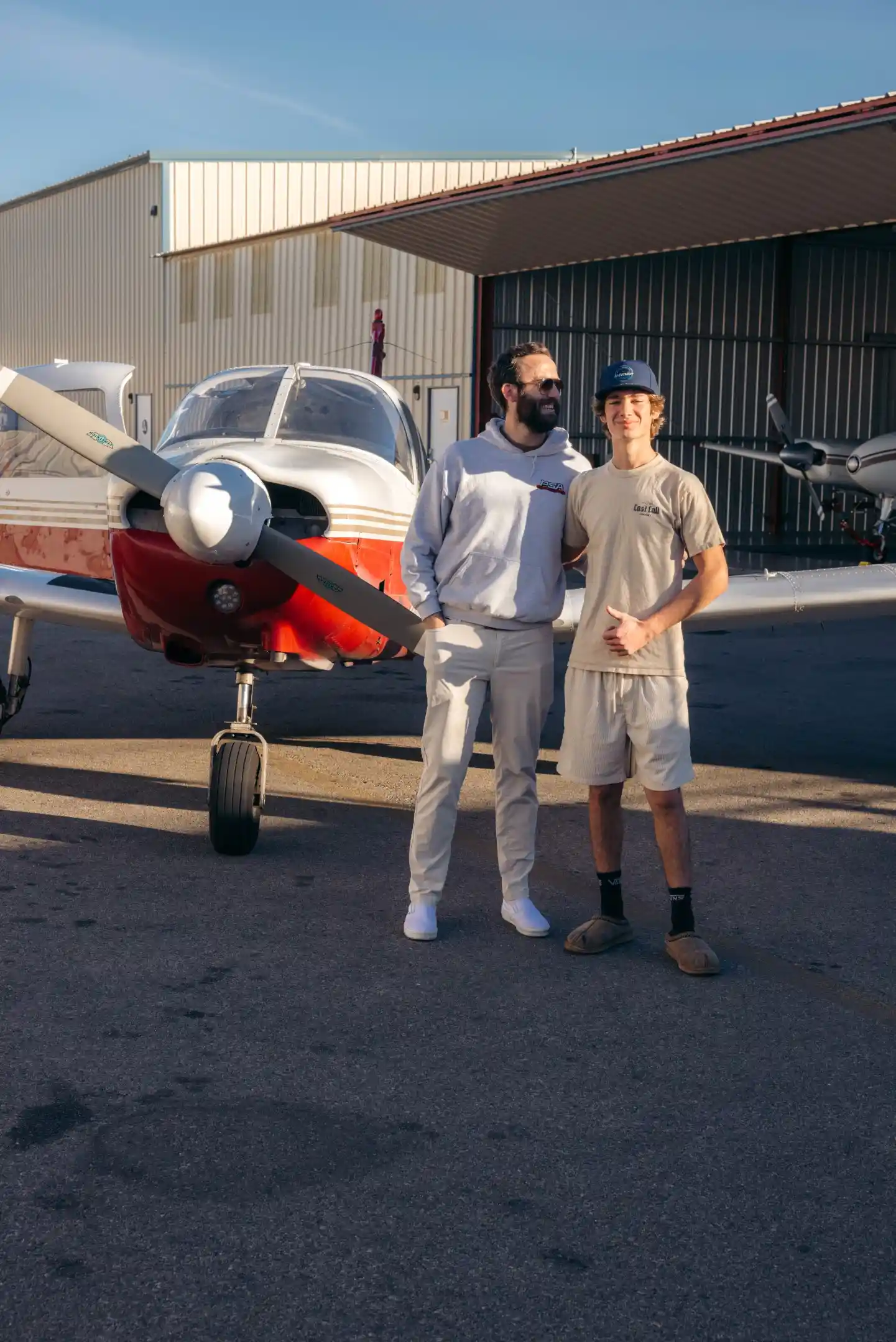 la flight academy los angeles flight school cfi student posing plane piper cherokee outside hangar 2