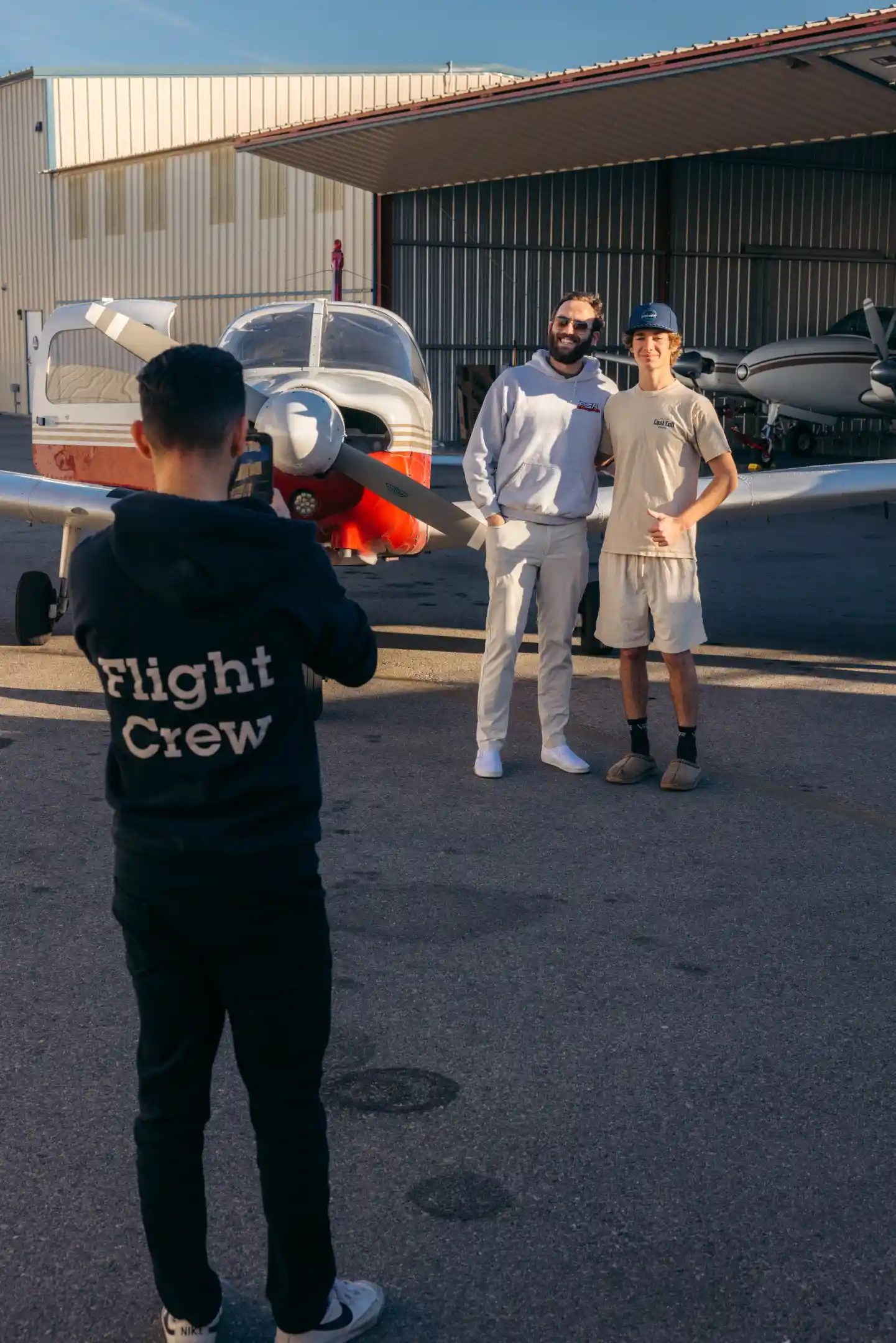 la flight academy los angeles flight school cfi student posing plane piper cherokee outside hangar