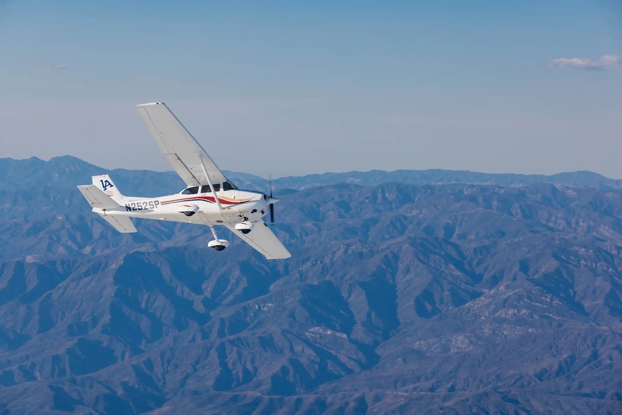 LA flight academy aircraft flying over Los Angeles, California