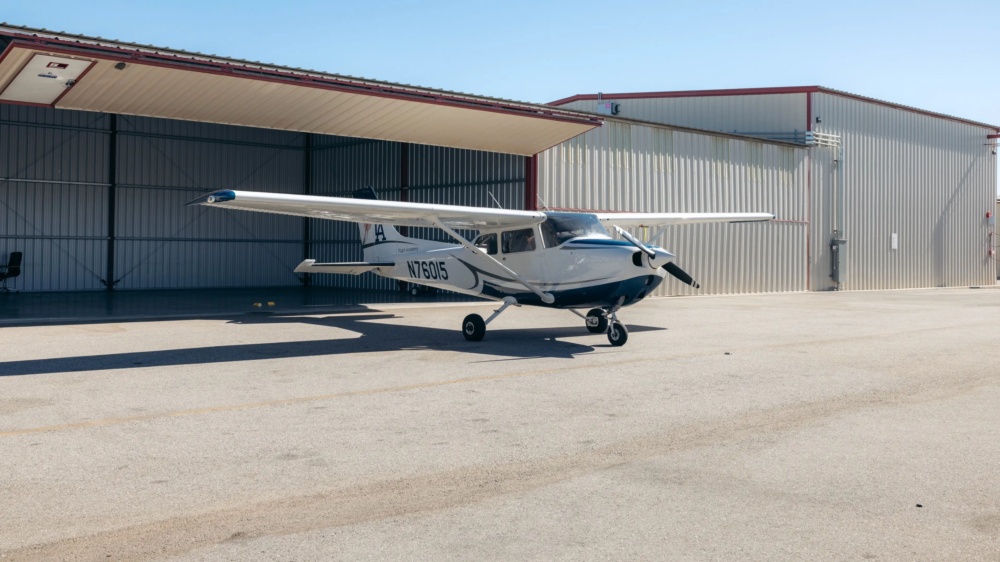 Cessna aircraft parked outside the hangar