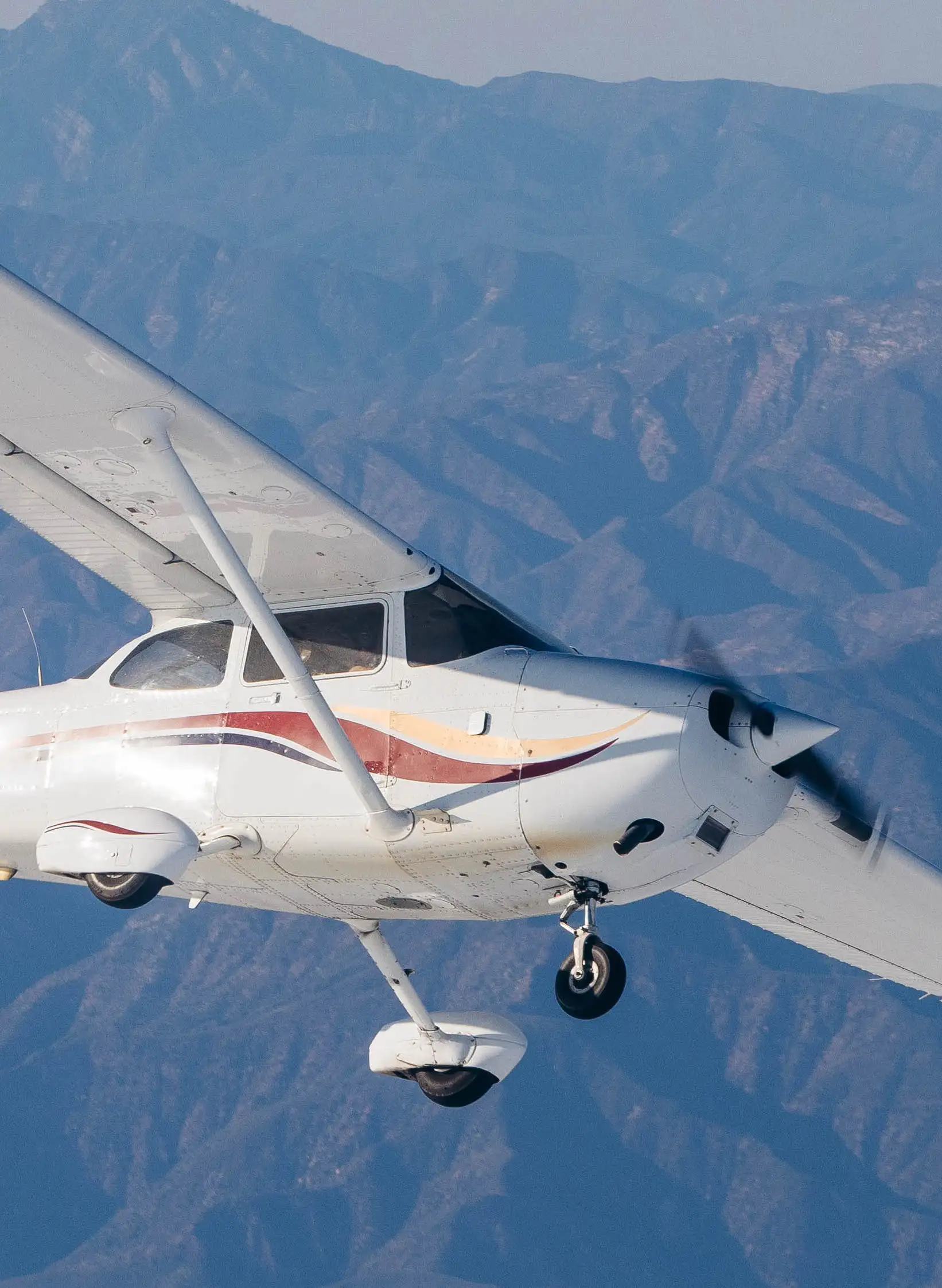 Instructor demonstrating spin recovery techniques to a pilot