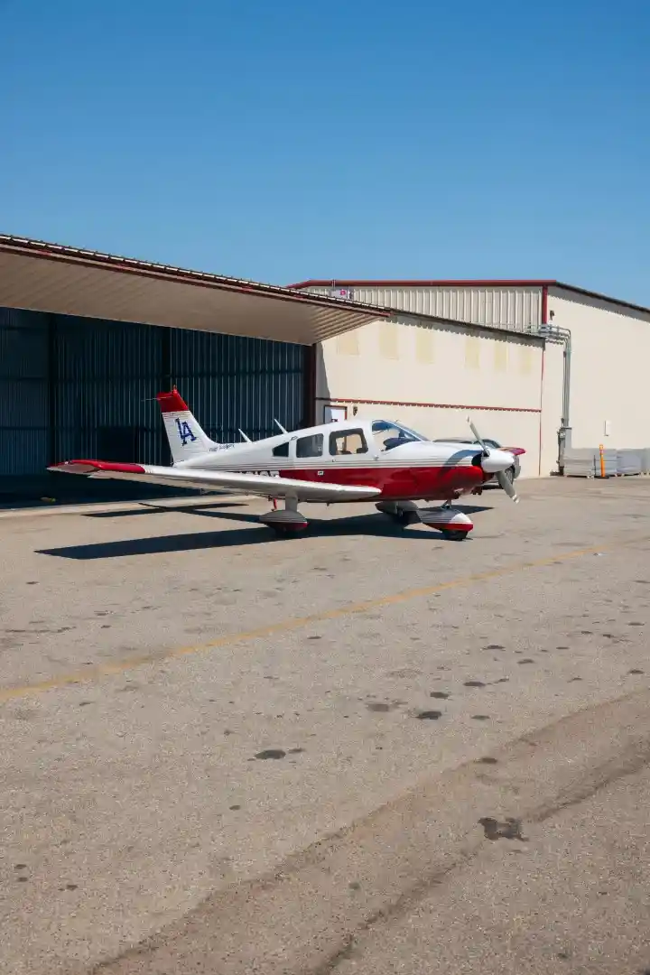 lafa plane piper cherokee outside hangar 2