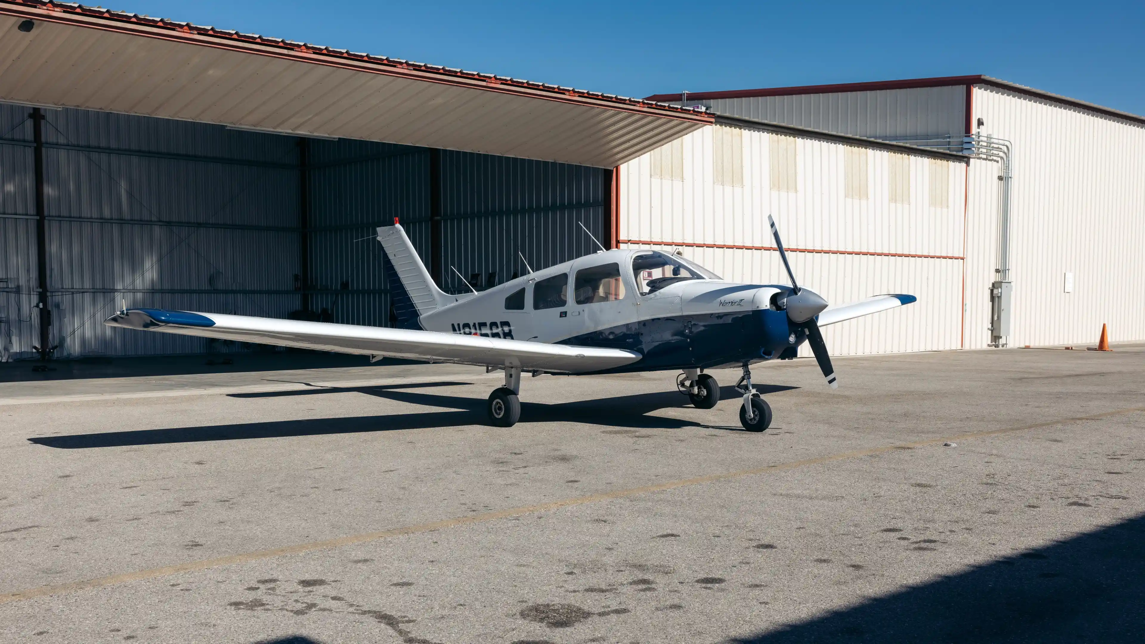 la flight academy los angeles flight school plane piper warrior ii outside hangar