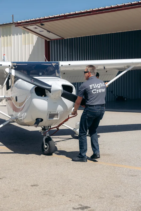 Executive student pilot reviewing flight plans in ground school