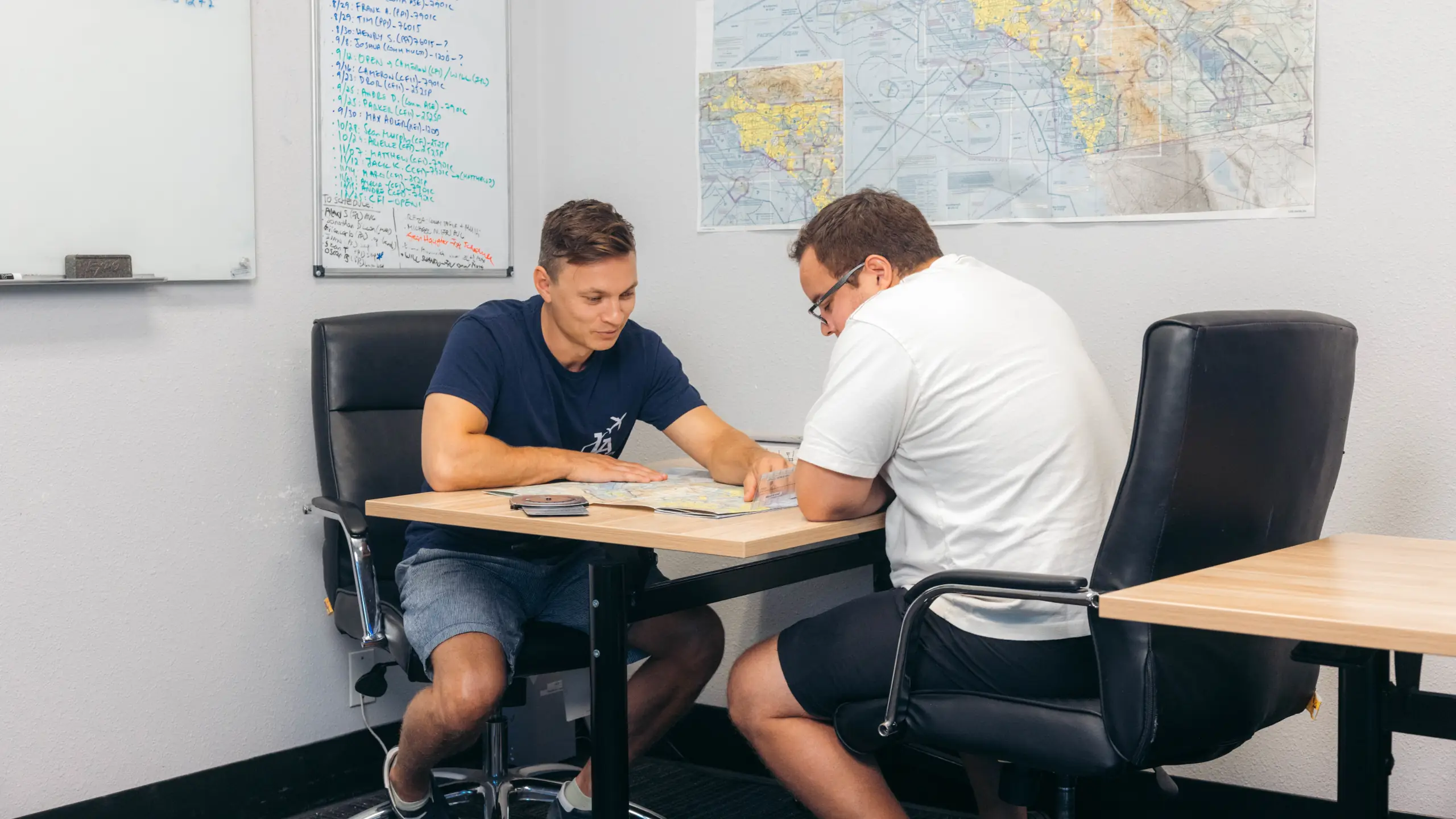 Student pilot reviewing a flight lesson during ground instruction at LA Flight Academy