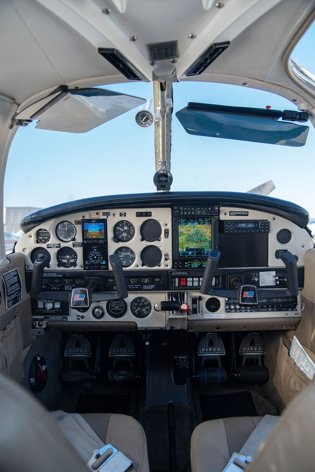 Centered cockpit view of a Piper Archer used for flight training