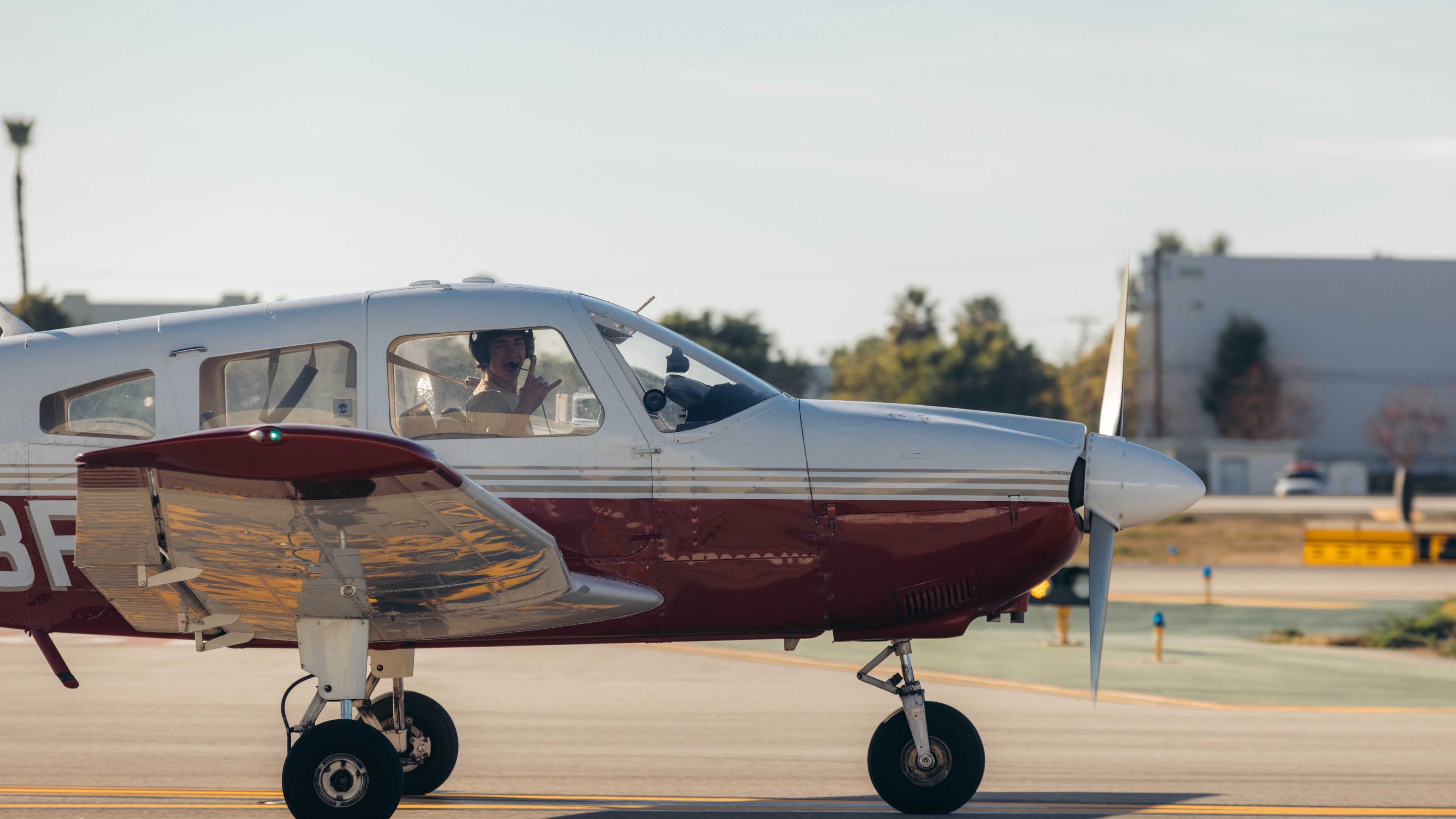 LA Flight Academy student and instructor preparing a Piper Cherokee before a flight lesson