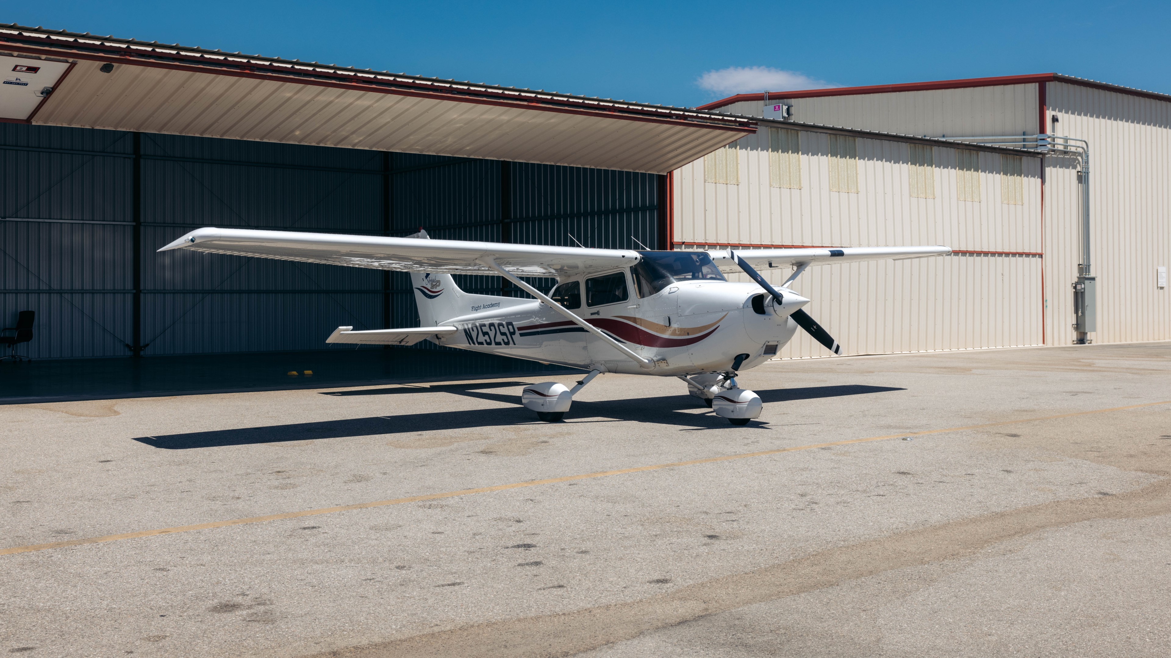 Cessna 172 flight training aircraft parked outside the hangar at Van Nuys Airport