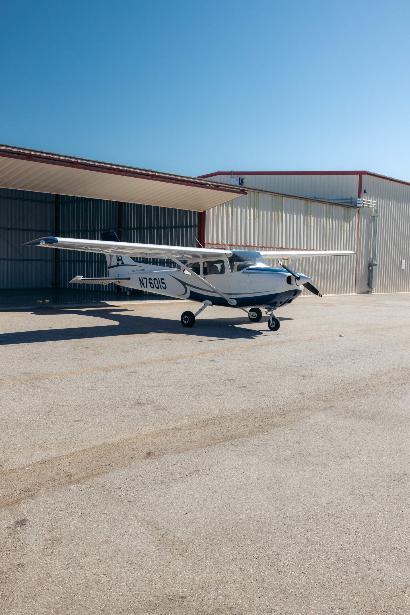 Cessna 172N training aircraft parked outside a hangar at Van Nuys Airport
